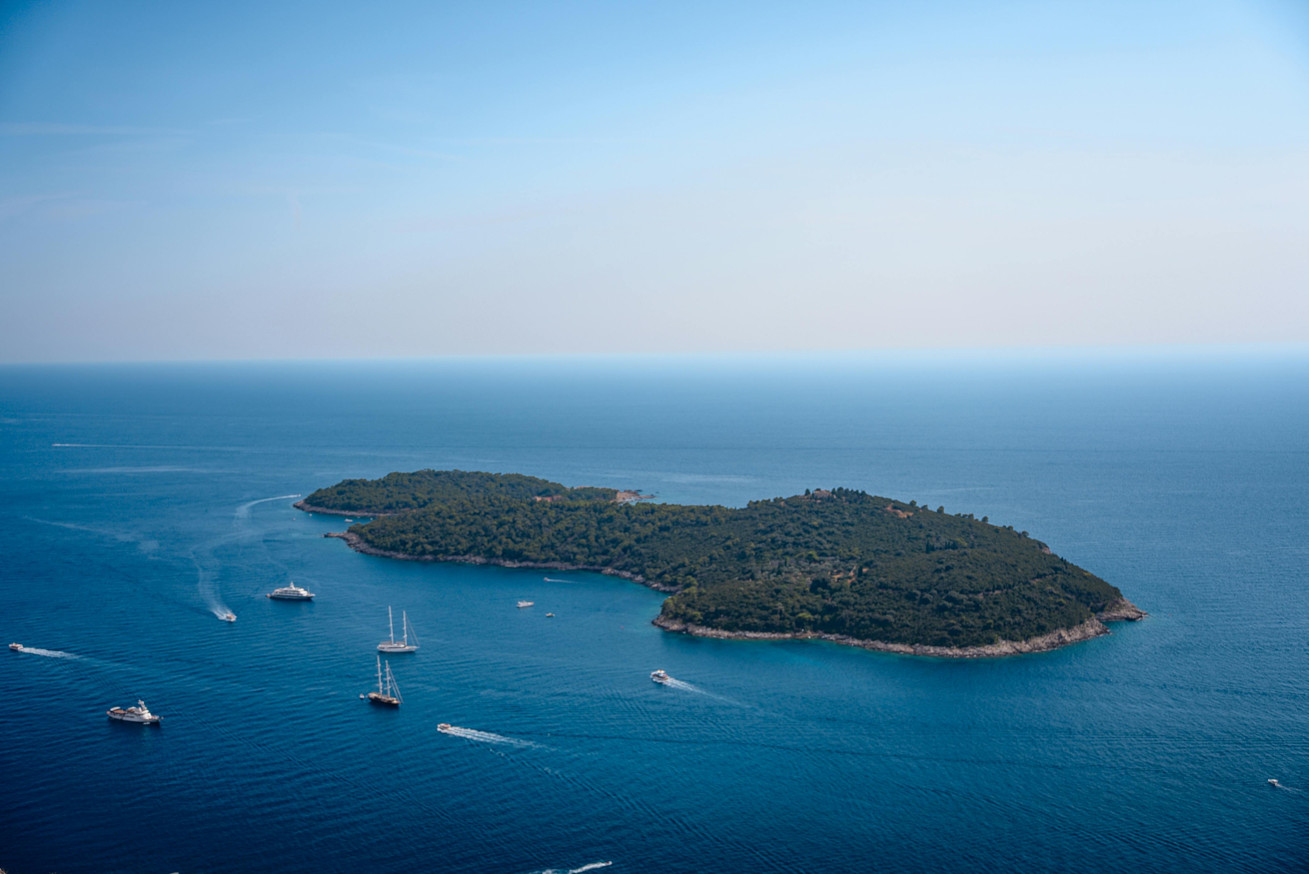 Aerial view of an island with boats in the Adriatic Sea near Dubrovnik, Croatia.