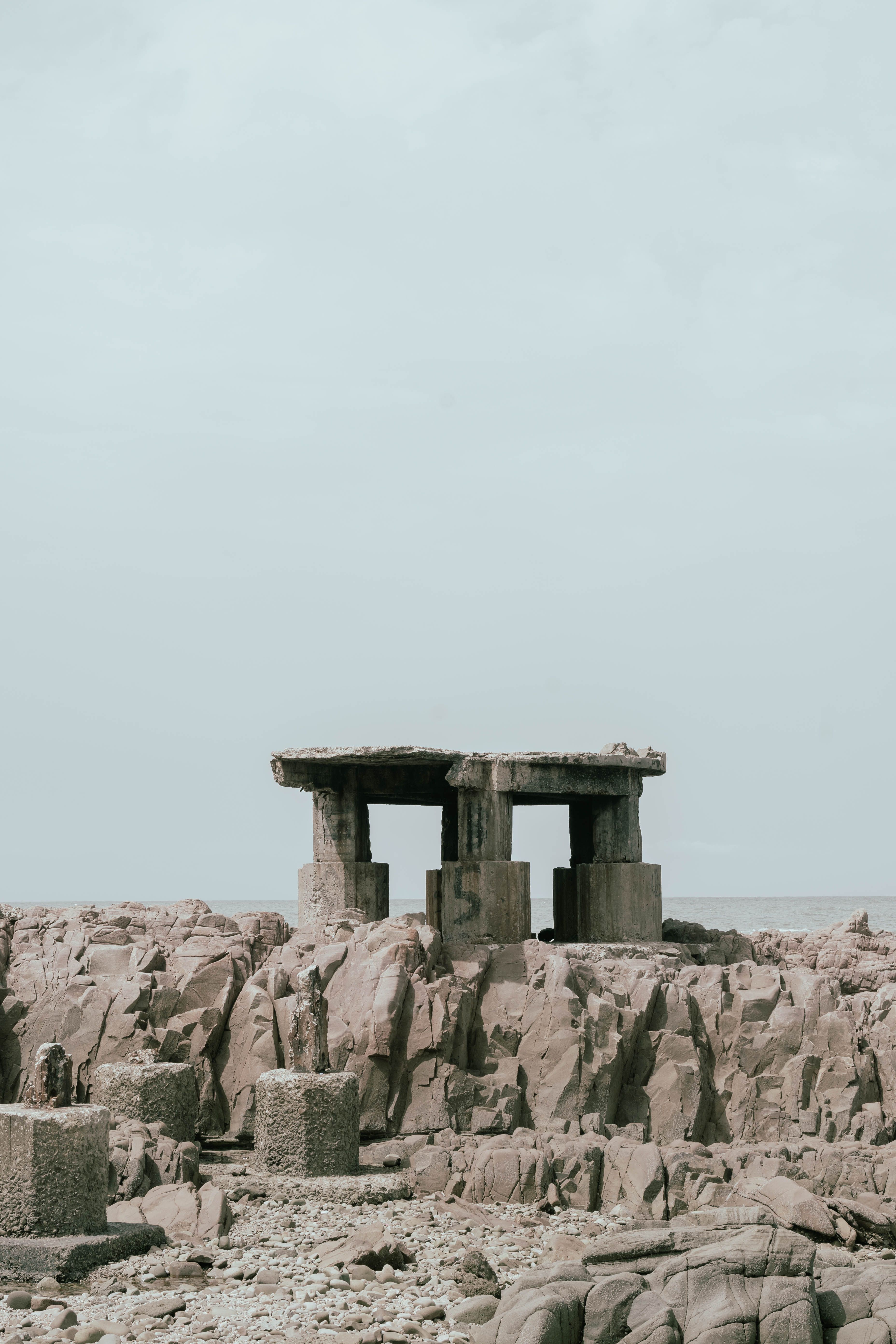 Ancient Stone Structure on Rocky Seashore · Free Stock Photo