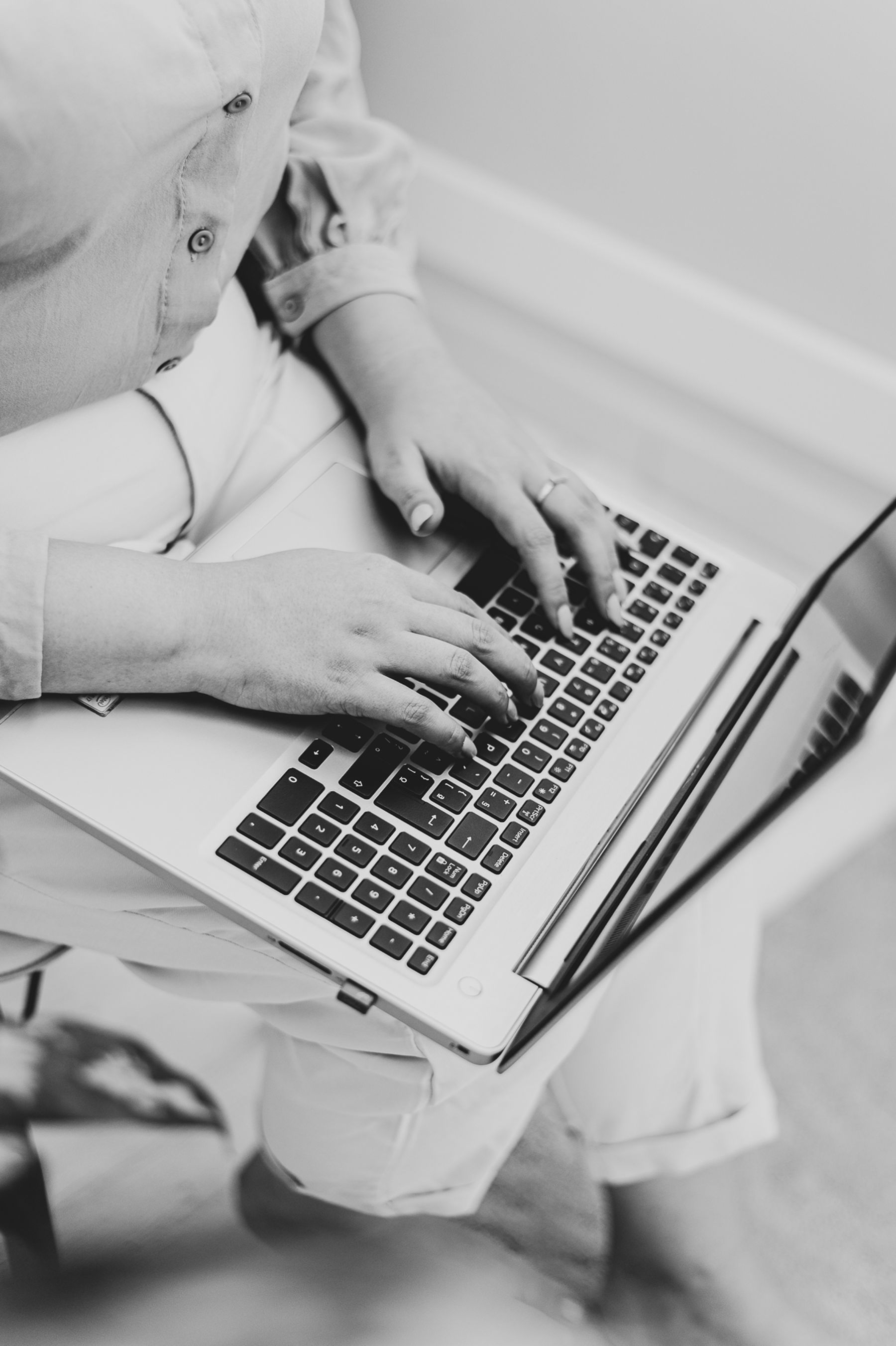 Close-up of a business owner working on a laptop