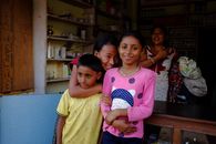 Smiling children inside a vibrant local shop, capturing joy and community spirit.