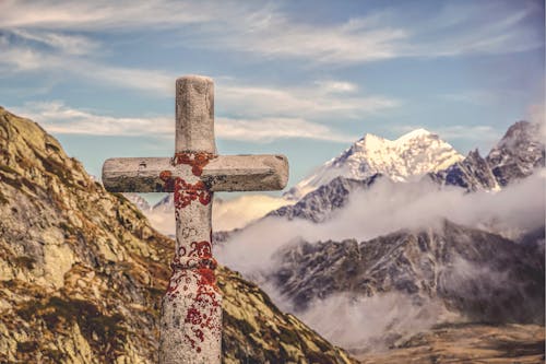 Free Gray Cross on Mountains  Stock Photo