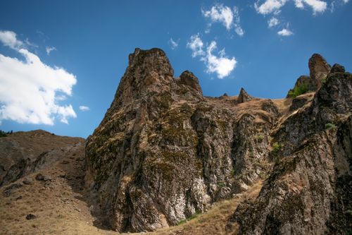 Free Dramatic rocky cliff in Muş, Turkey, captured under a bright blue sky, showcasing natural beauty. Stock Photo