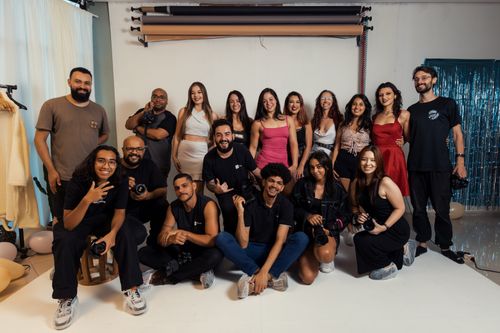Free A diverse group of photographers posing together in a studio setting in Brazil, showcasing camaraderie. Stock Photo