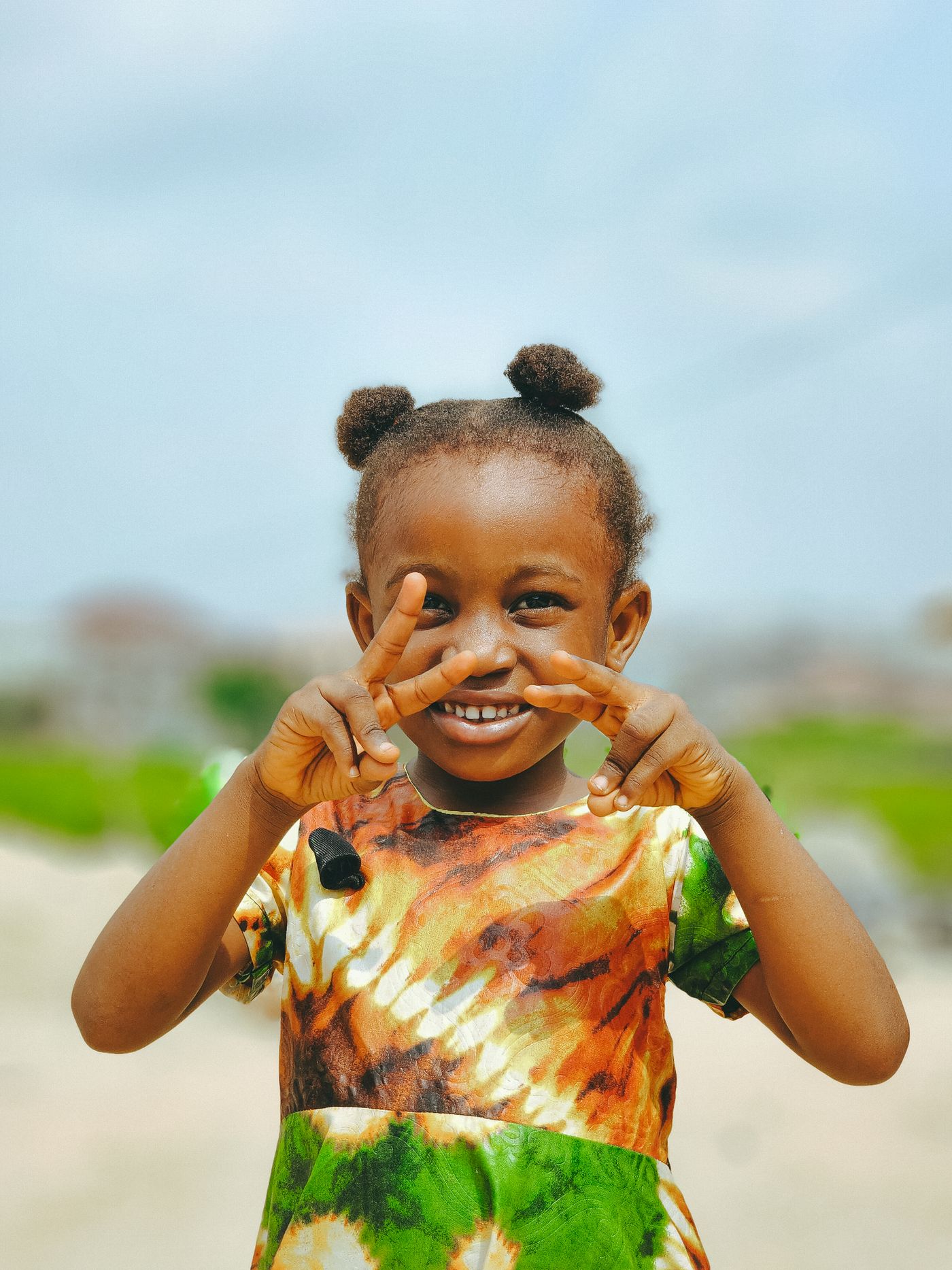 A young girl outdoors, the dress easy to move in.