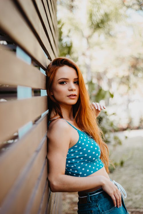 Free Photo Of Woman Leaning On Wooden Wall Stock Photo