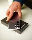 Hand Holding Samsung Galaxy S25 Ultra over Box