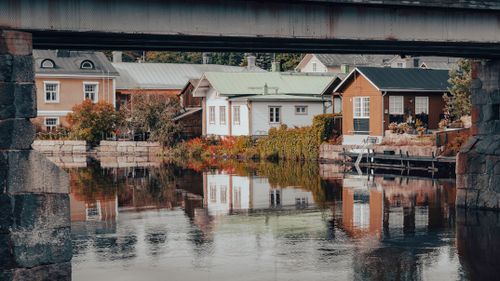 Free Scenic view of traditional wooden houses along the river in Porvoo, Finland. Stock Photo
