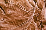 Abstract Swirls of Brown Paint Texture