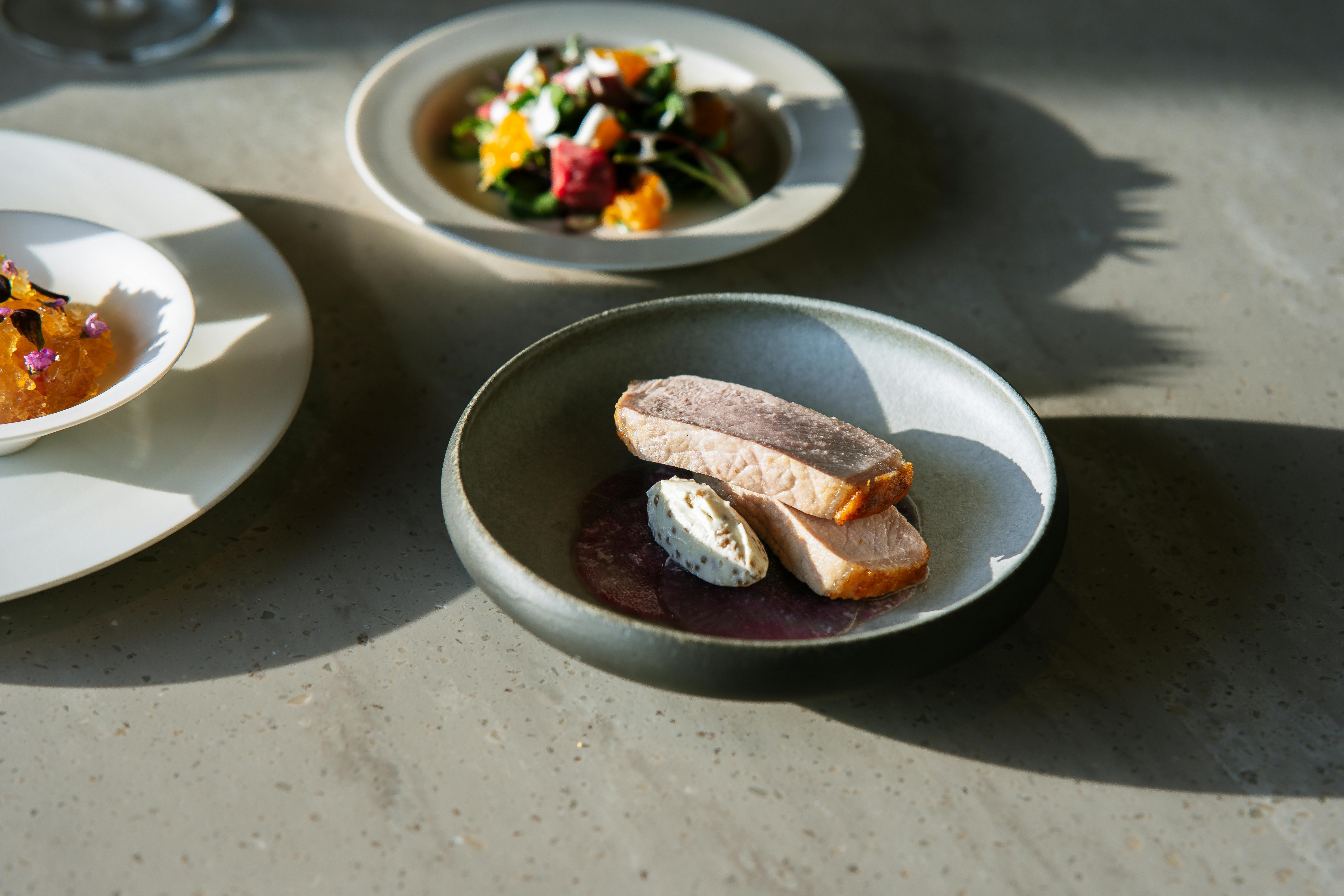 A beautifully plated dish from Grey Ghost Detroit, showcasing modern culinary artistry - fancy restaurants in metro detroit