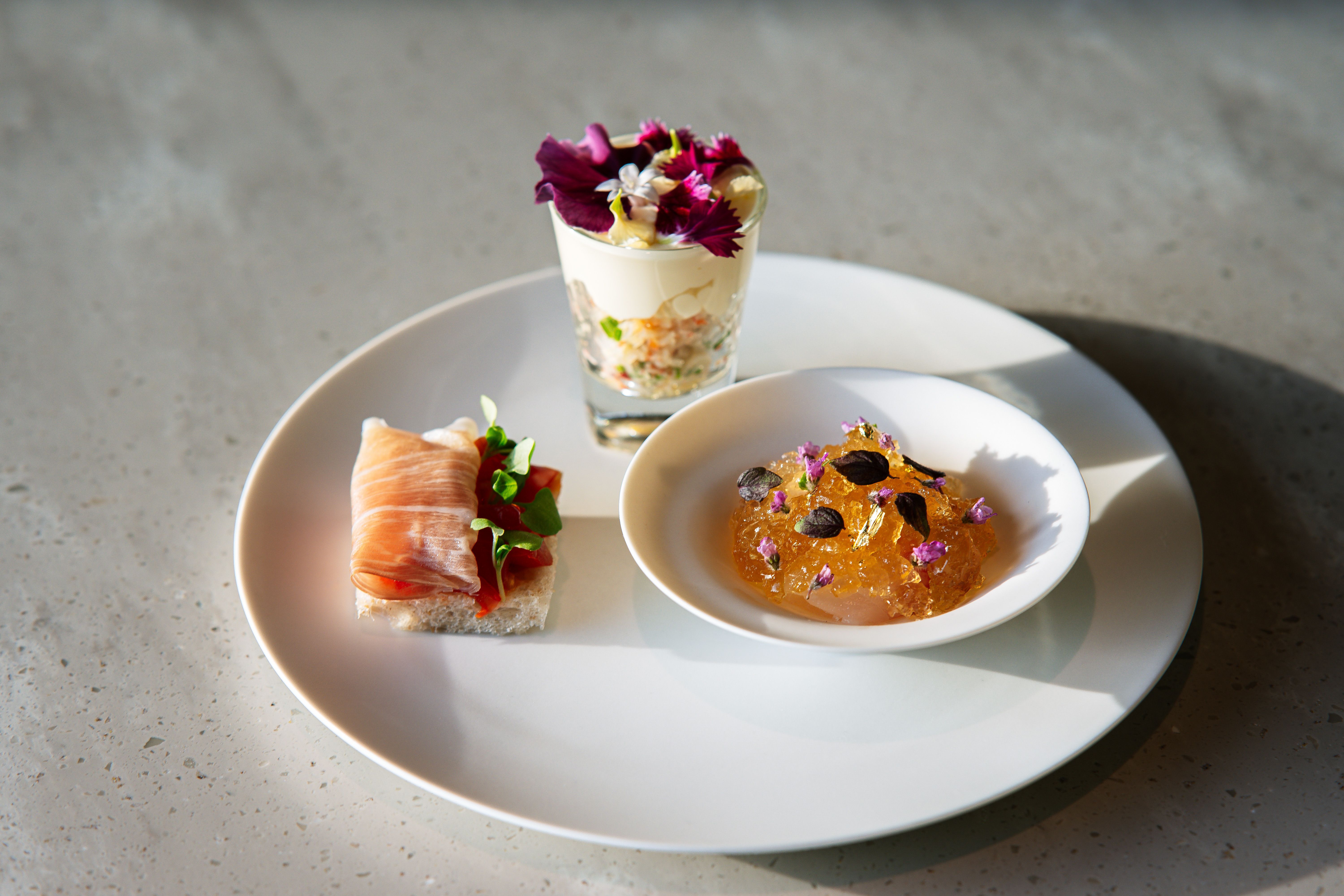 Elegant dessert platter featuring floral elements and gourmet presentation.
