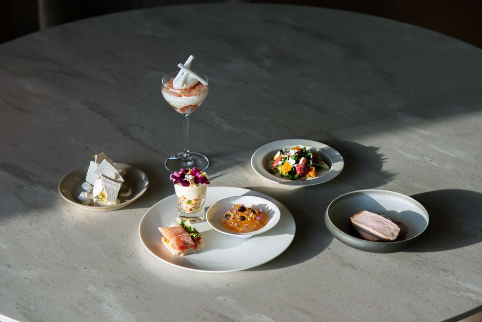 An exquisite arrangement of gourmet dishes presented on a table, showcasing culinary artistry.
