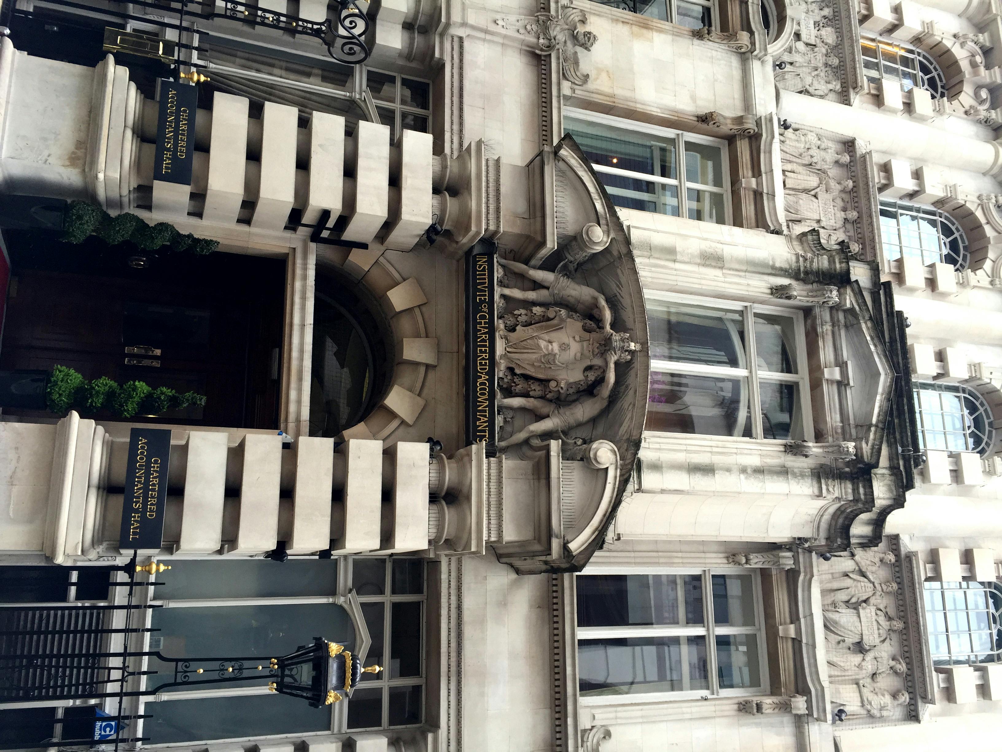 A painted sci-fi miniature model posed on a tabletop terrain piece