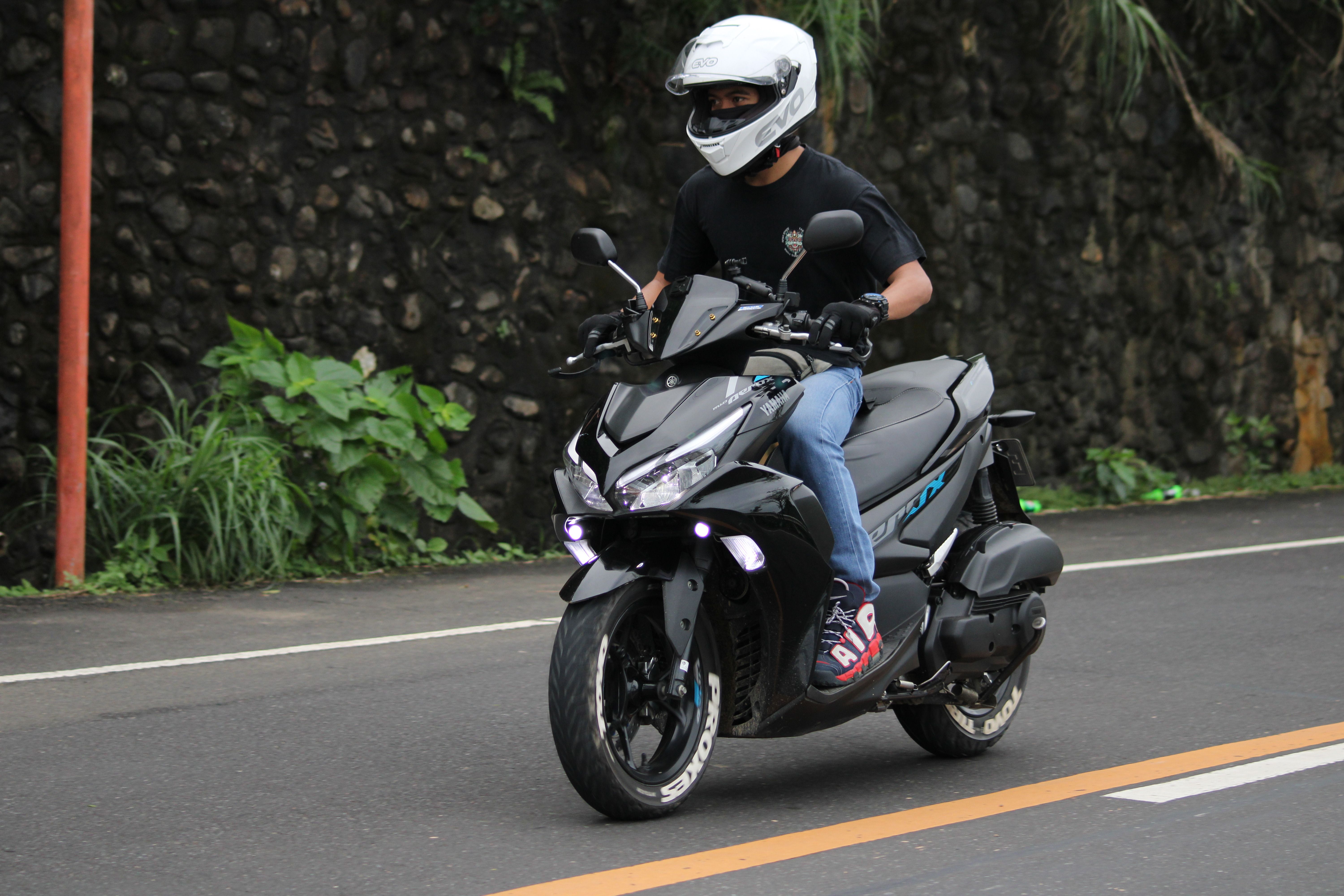 Motorcyclist Riding Along Scenic Road in Sagñay · Free Stock Photo