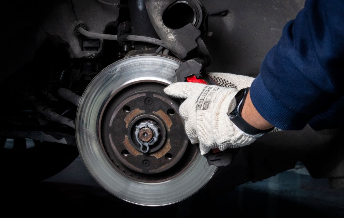 Automotive brake maintenance being completed in a workshop
