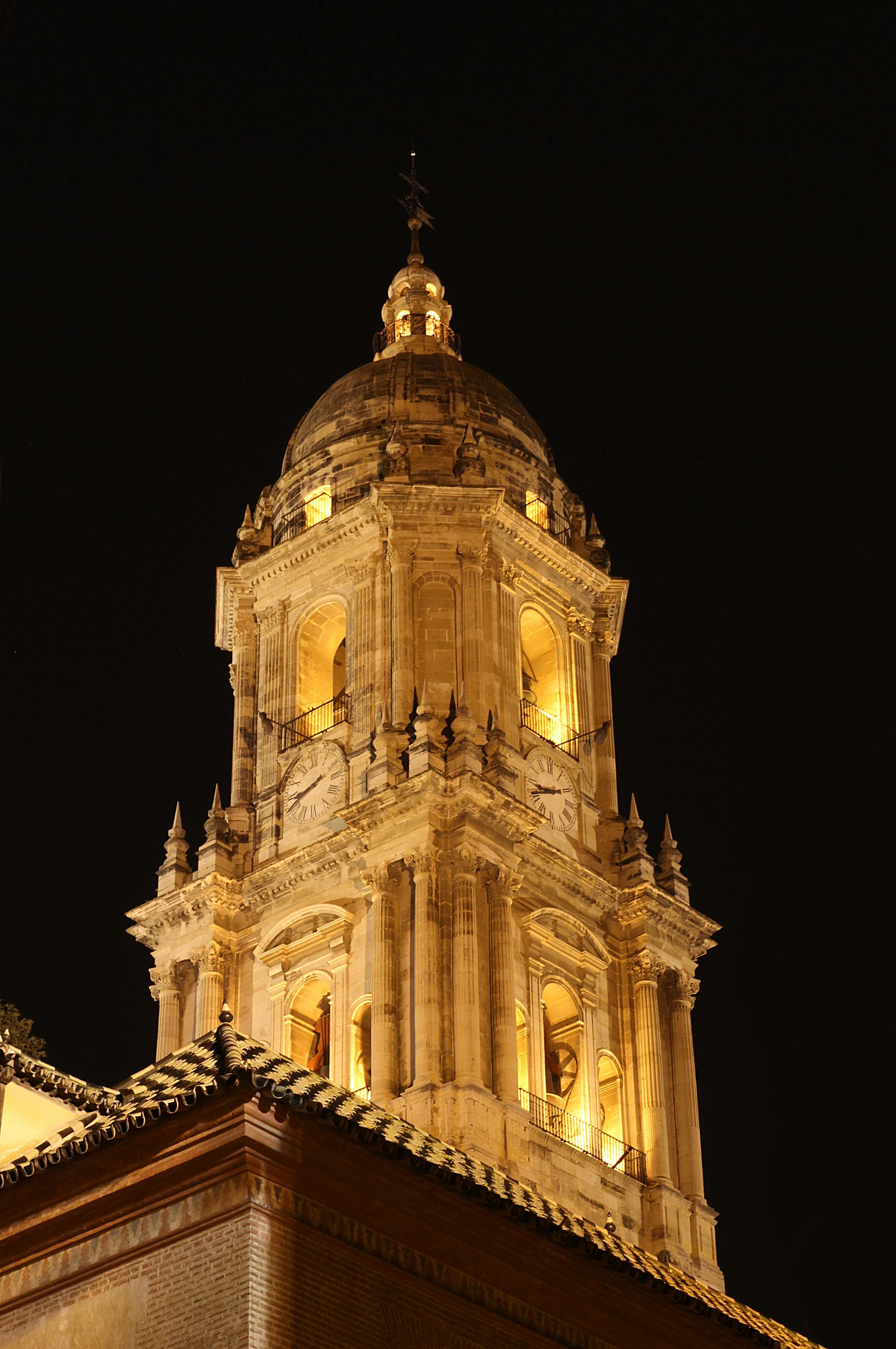 Stunning night view of the illuminated Málaga Cathedral tower, Andalucía, Spain.