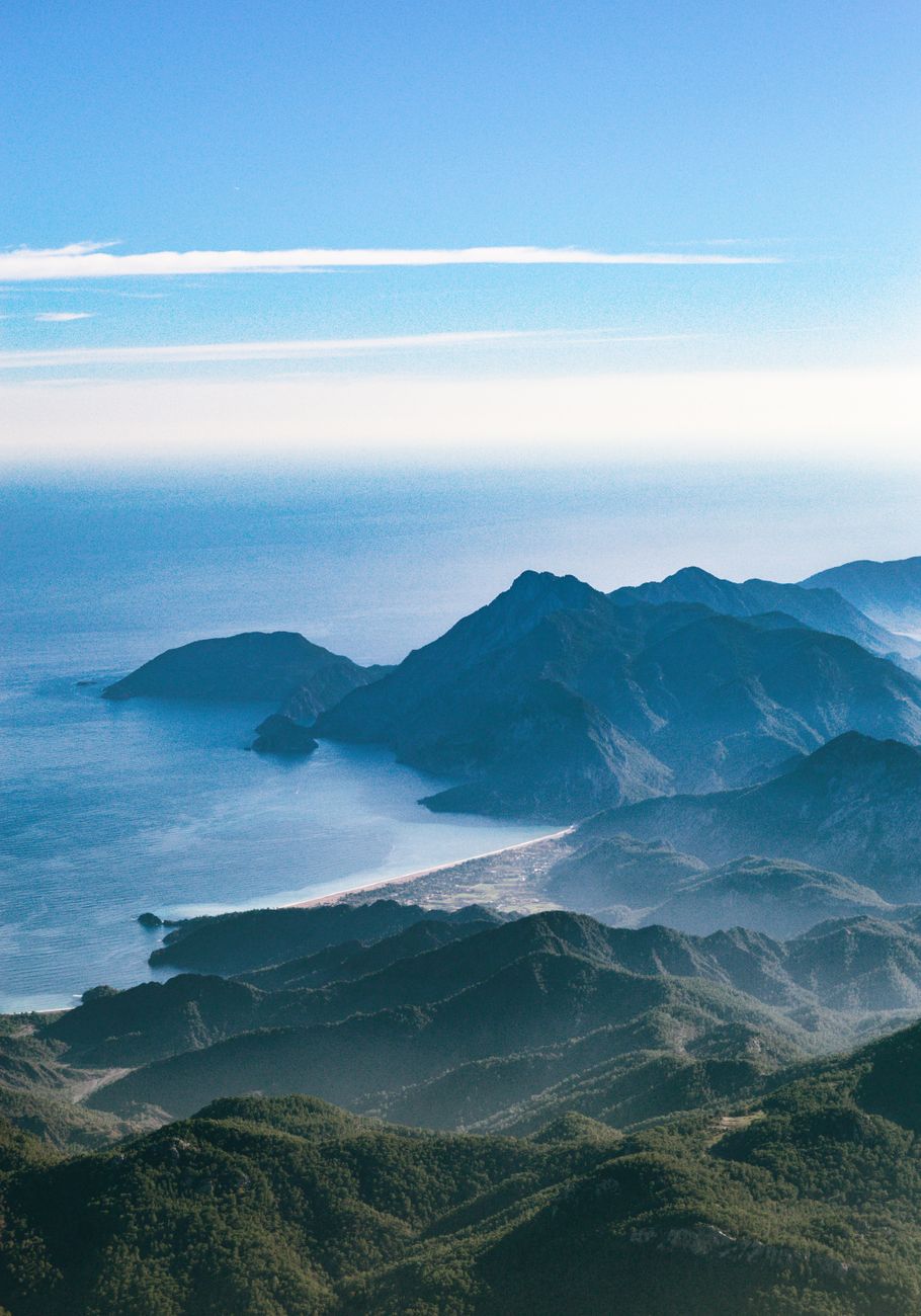 A breathtaking aerial view of the Turkish coastline with lush mountains and the serene sea.
