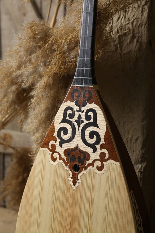 Free Close-up of traditional Kazakh dombyra showcasing intricate craftsmanship and cultural heritage. Stock Photo