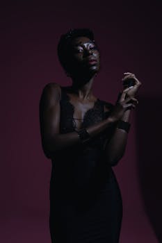 Captivating dark portrait of a fashion model with moody lighting and elegant pose.