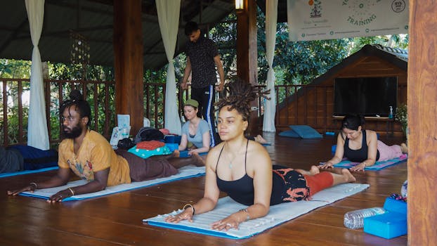 People practicing yoga together in a serene outdoor retreat