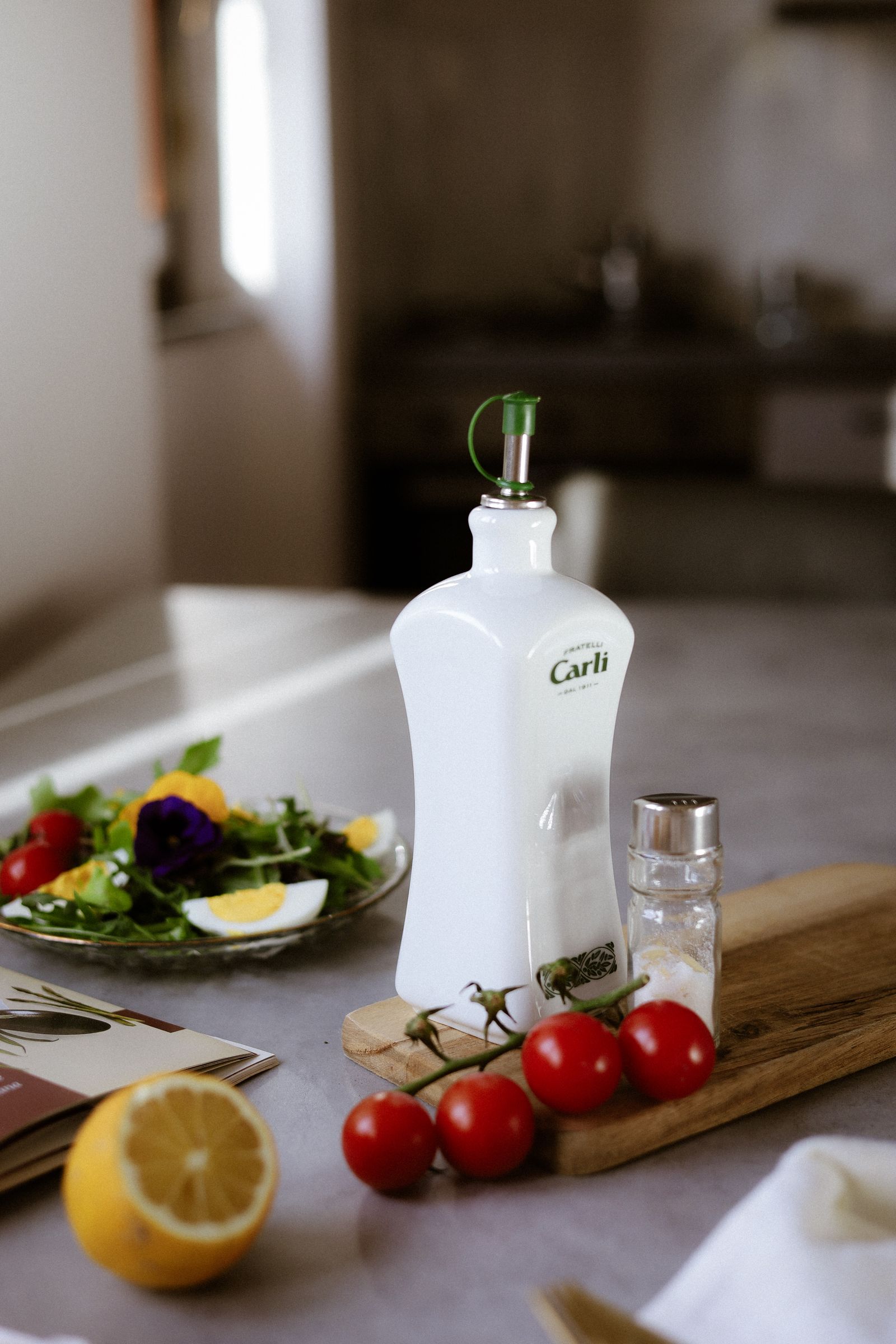 Elegant kitchen setting with an olive oil bottle on the table.