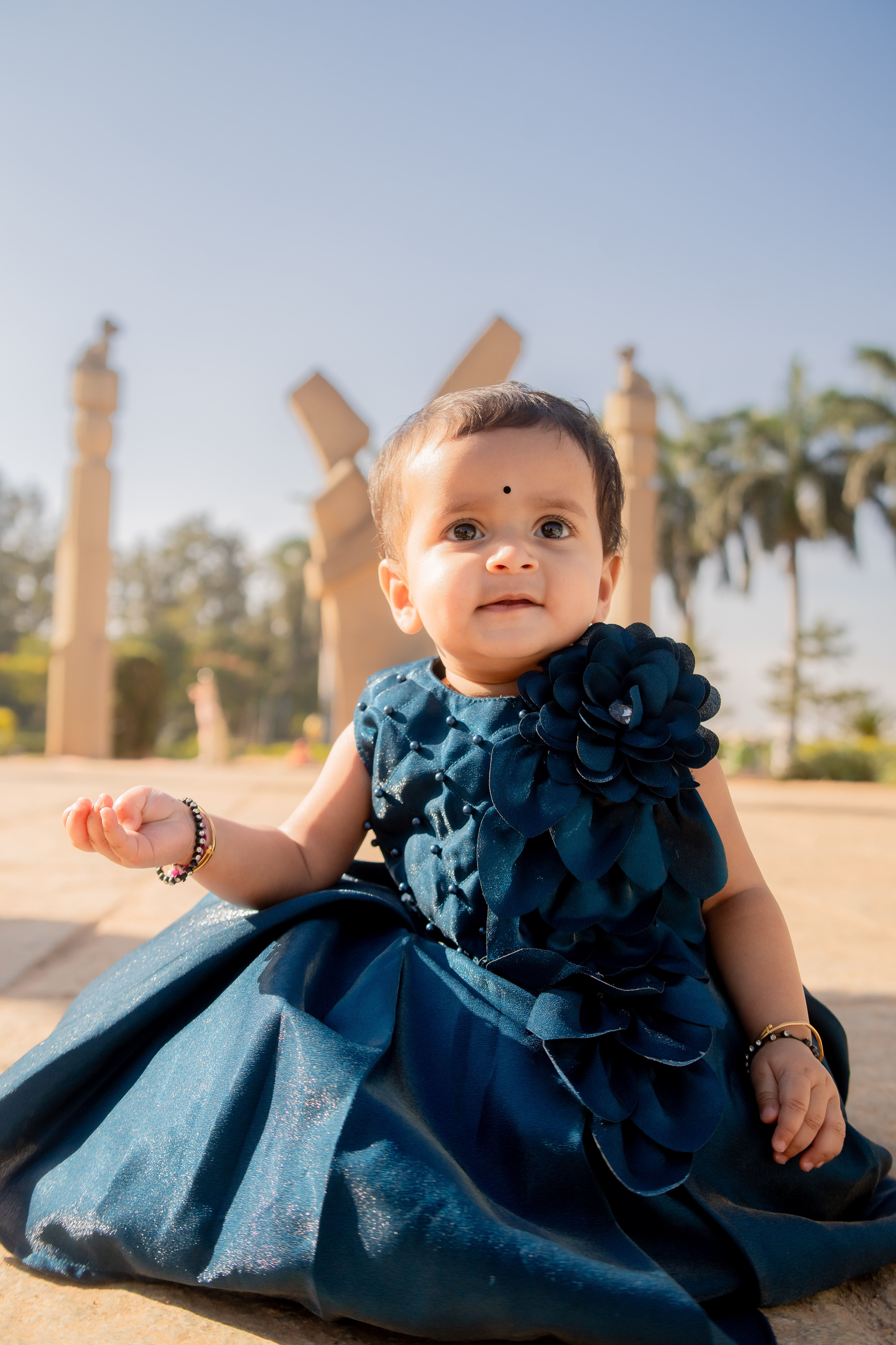Adorable Baby in Blue Dress at Historical Monument  Free Stock Photo