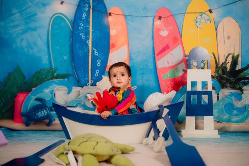 Free Colorful children's nautical theme with surfboards and toy boat. Stock Photo