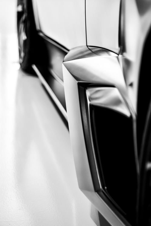 Free Striking black and white close-up of a sleek sports car's modern design lines. Stock Photo