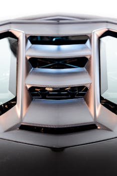 Detailed view of a sports car engine vent showcasing modern design and aerodynamics.