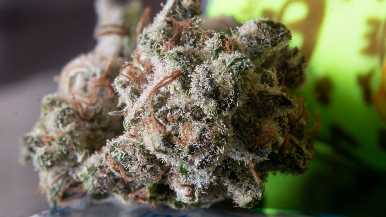 Macro photograph of a cannabis bud showcasing trichomes and detail.