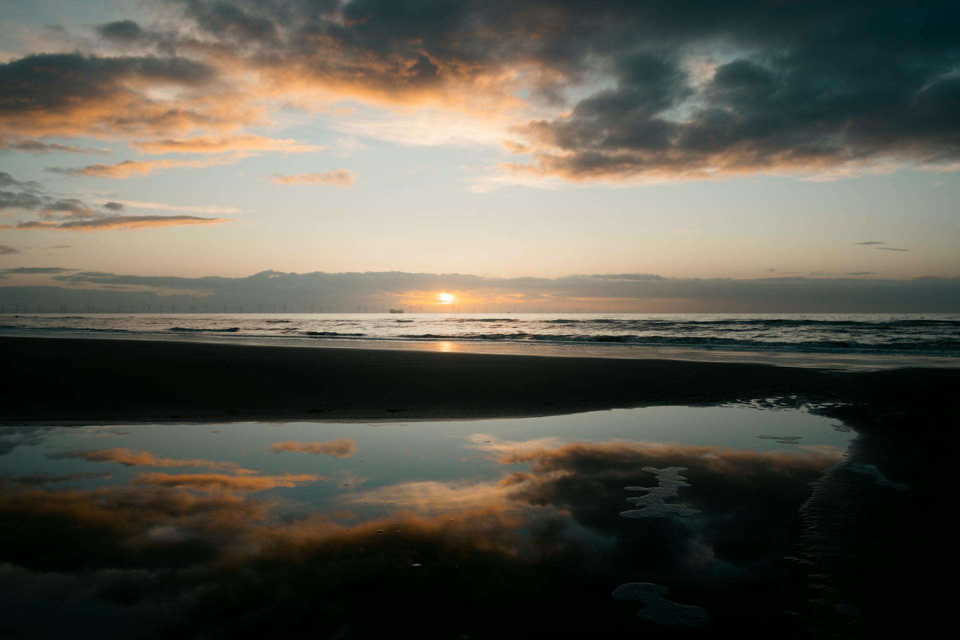 Serene country lane through forest at dusk