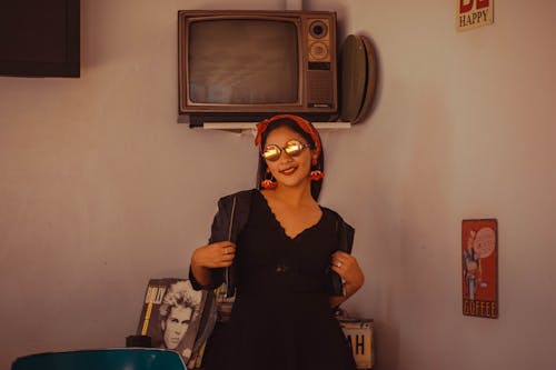 Woman Wearing Black V-neck Dress and Sunglasses