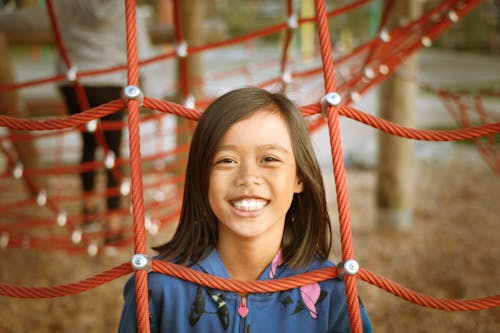 Free Girl Standing Behind Rope Stock Photo