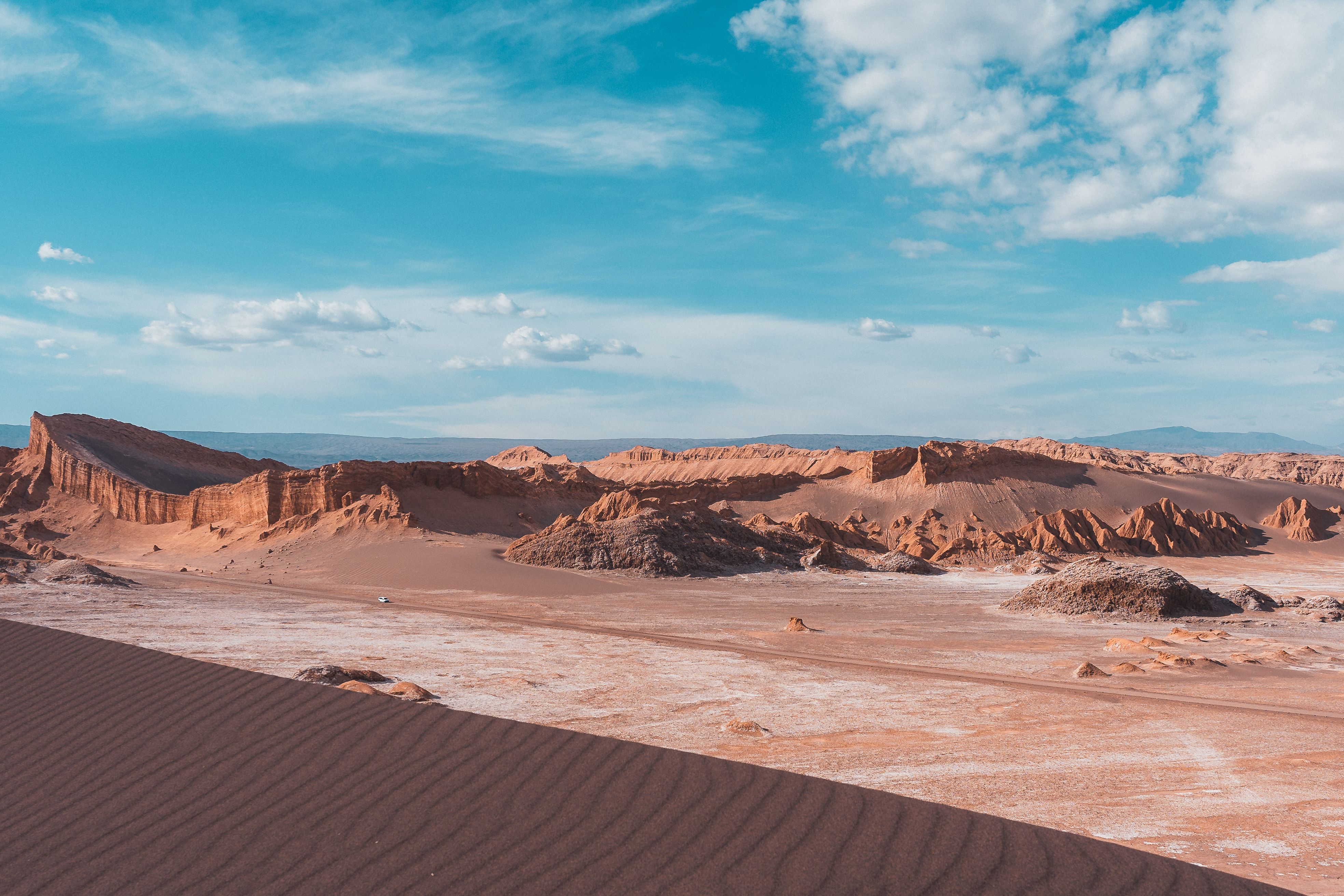 Stunning sunset over the moon-like landscape of Valle de la Luna in San Pedro de Atacama, Chile