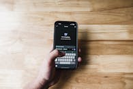 Person Using Smartphone AI Assistant at Home