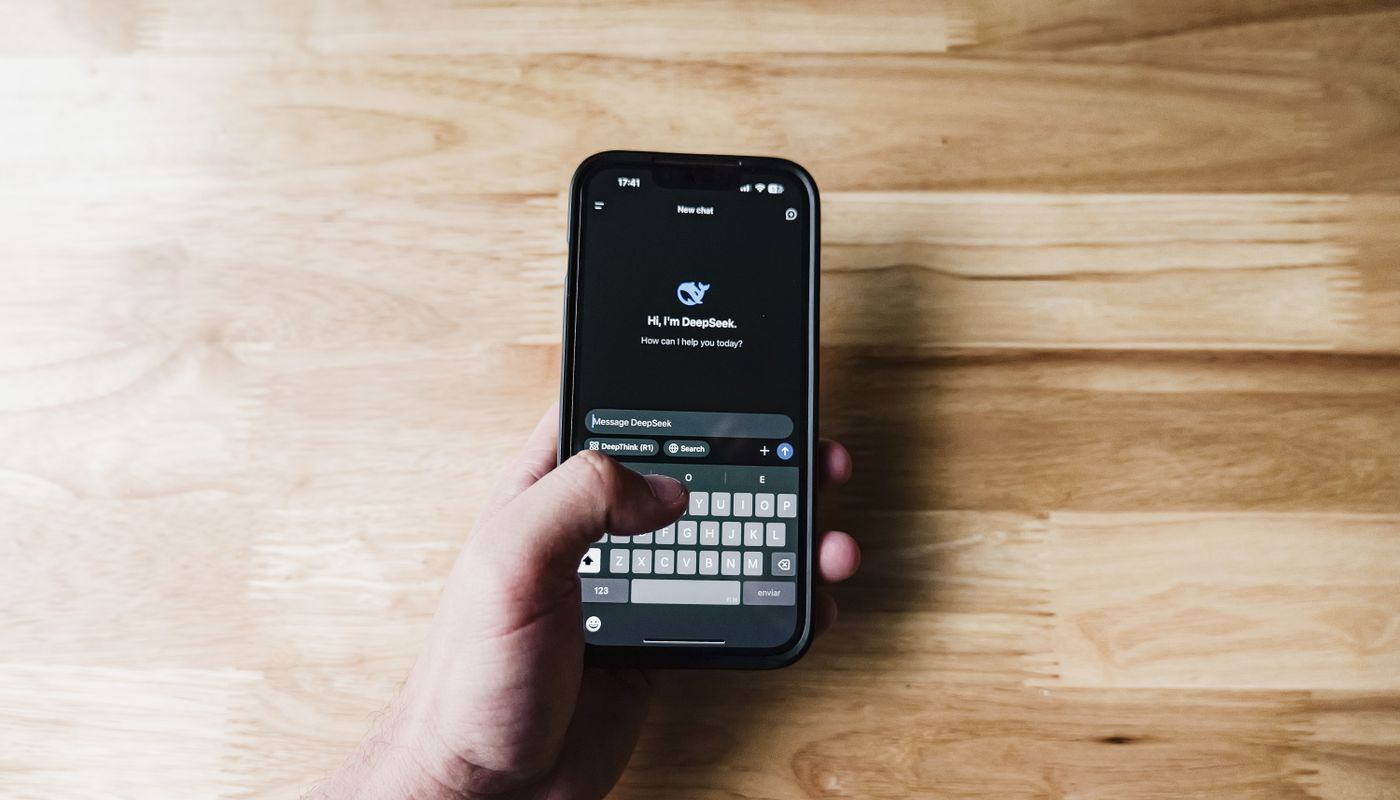 Person reviewing an AI assistant response on a smartphone before acting on it