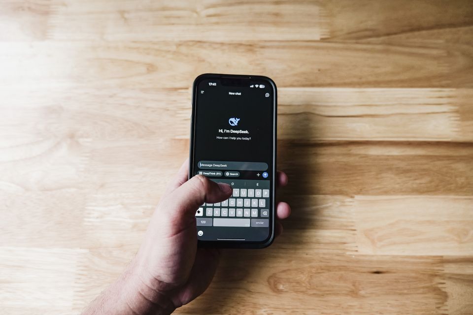 Person using an AI chat assistant on a smartphone at home, no sign up needed