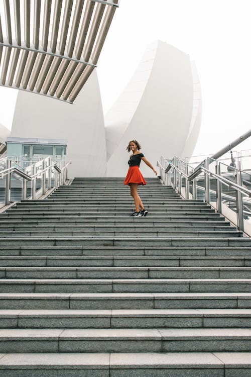 Woman Standing on Concrete Steps