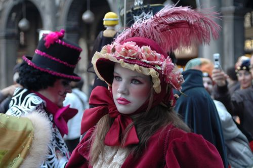 Free Close-up of a young woman in ornate costume at a lively Venetian Carnival. Stock Photo