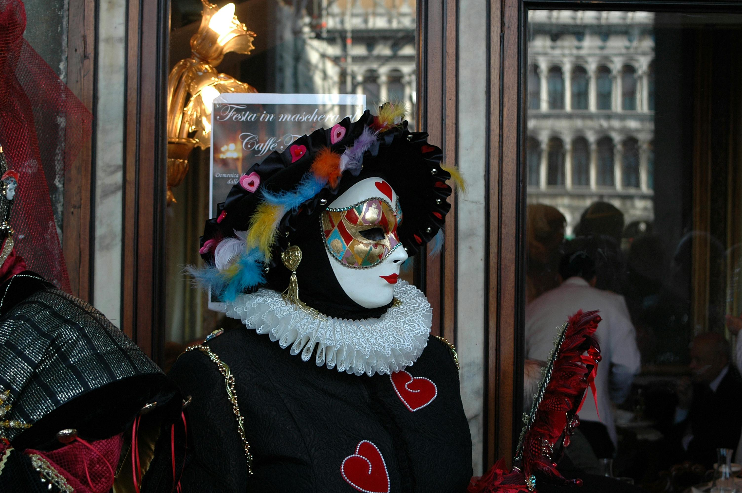 Venetian Carnival Masked Figure with Heart Motifs · Free Stock Photo