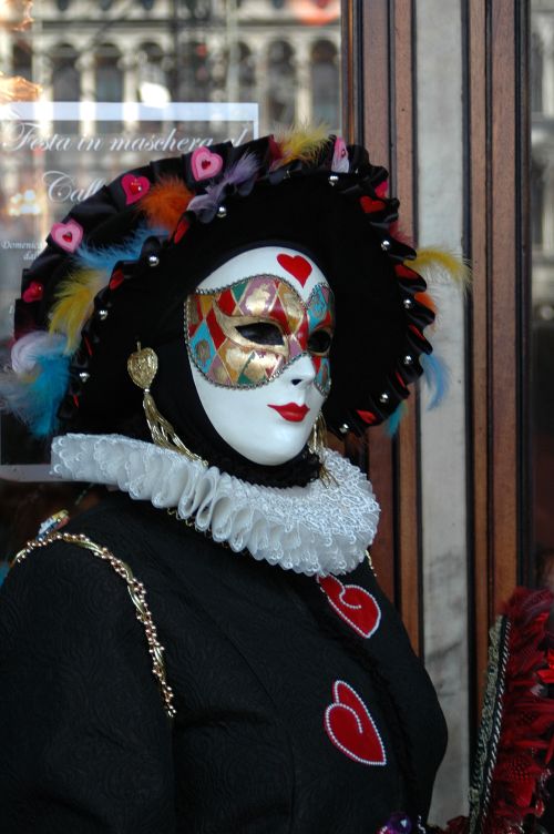 Free Masquerade costume with a decorative mask at Venetian Carnival. Stock Photo
