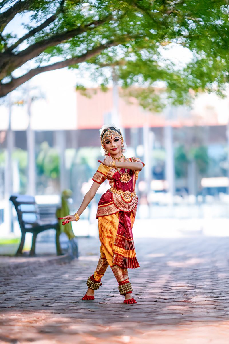 Graceful Bharatanatyam dancer in vibrant attire