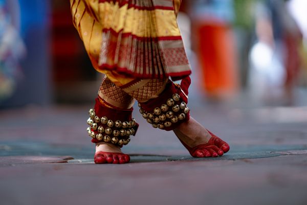 Close-up of classical Indian dance footwork with ghungroo anklets