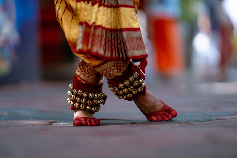 Close-up of classical Indian dance footwork with ghungroo anklets