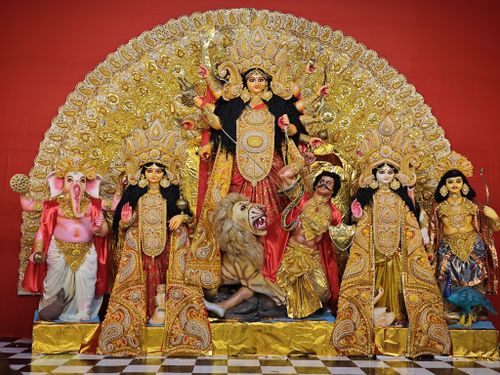 Free Colorful Durga Puja festival idol display showcasing intricate artistry and cultural richness in celebration. Stock Photo