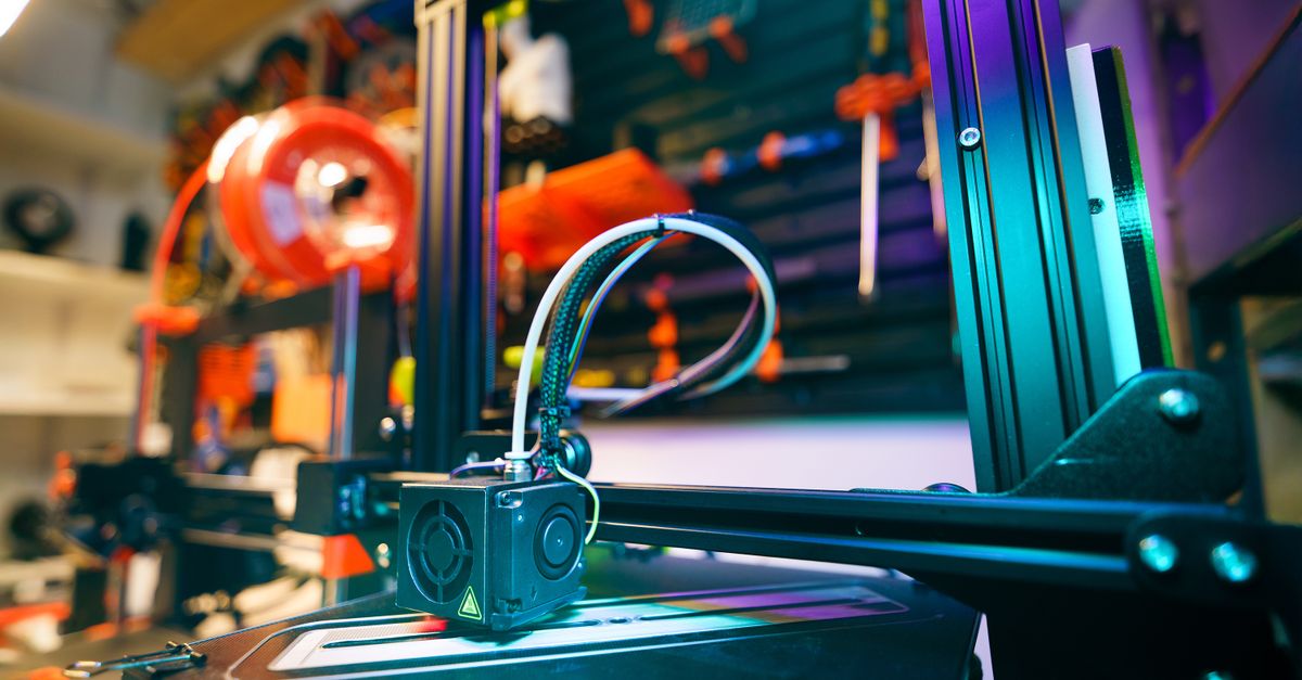 Organized 3D printer workspace in a modern workshop
