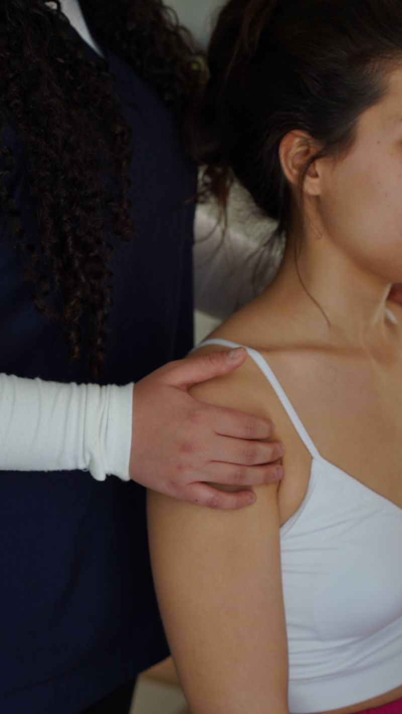 Physiotherapist treating a patient's shoulder at Ontario Physio Centre in Brampton