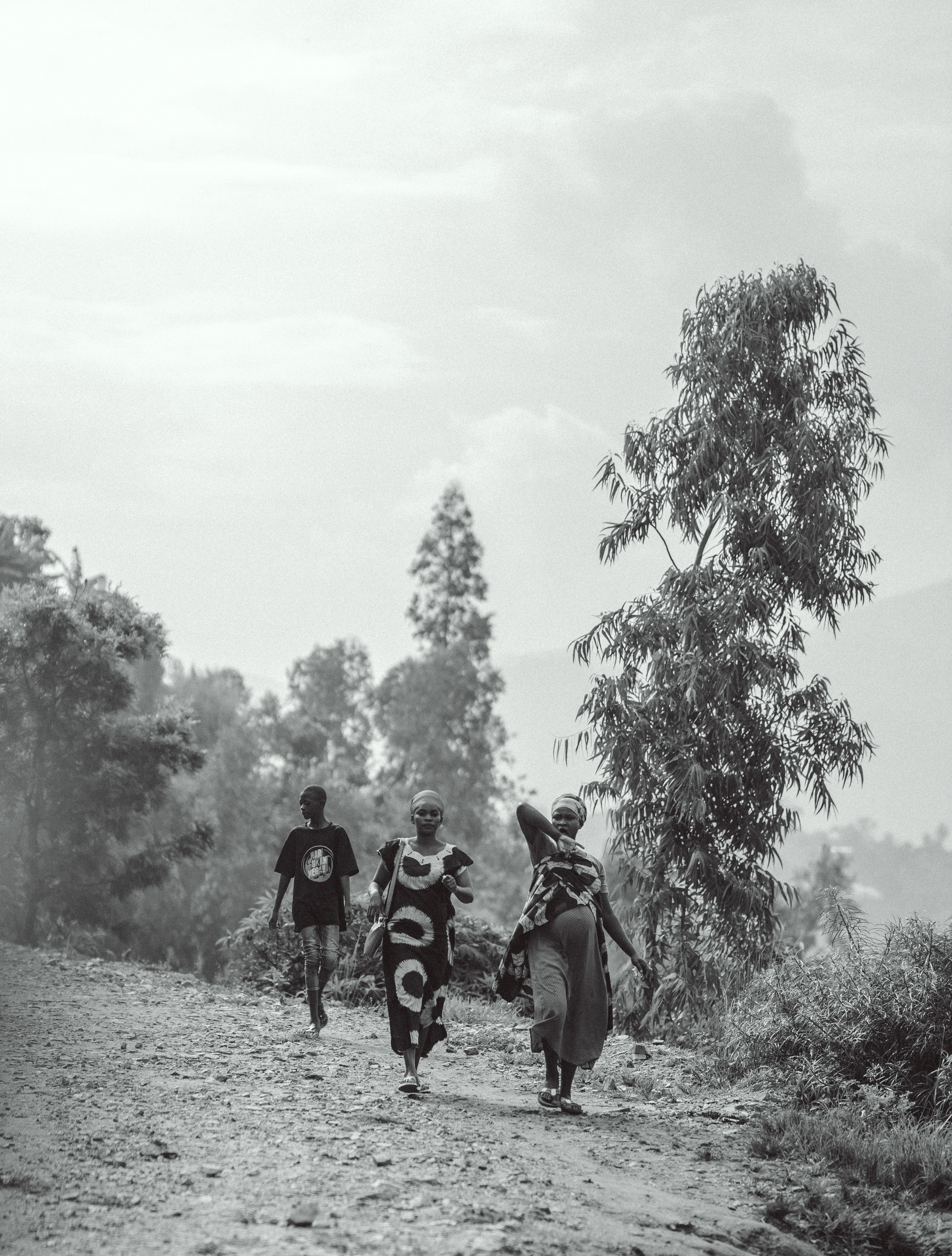 People Walking Along a Rural Pathway · Free Stock Photo