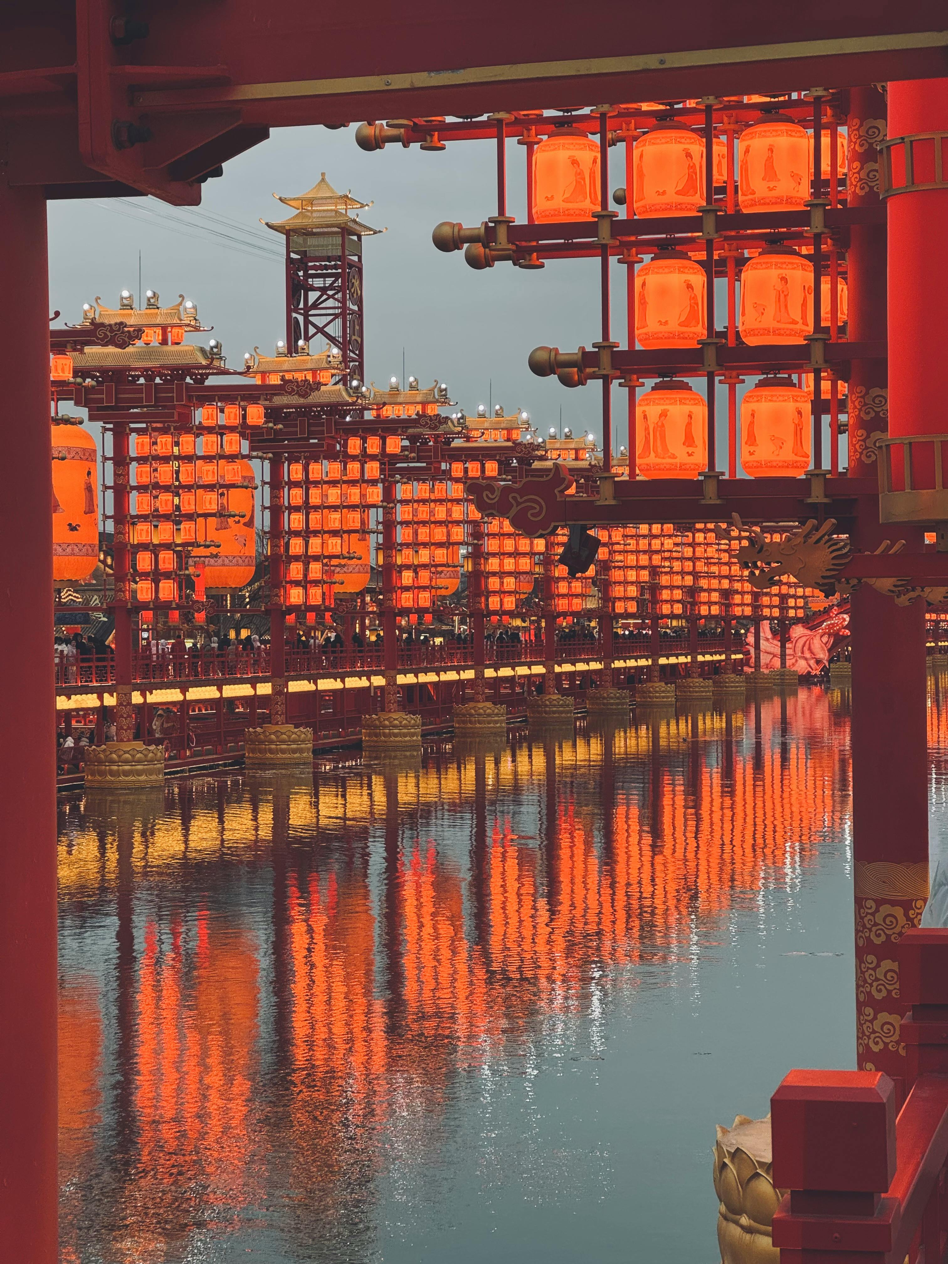 vibrant red lanterns reflecting on water in china