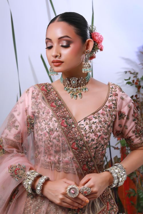 Free Captivating portrait of an Indian bride in traditional attire with floral details in Delhi. Stock Photo