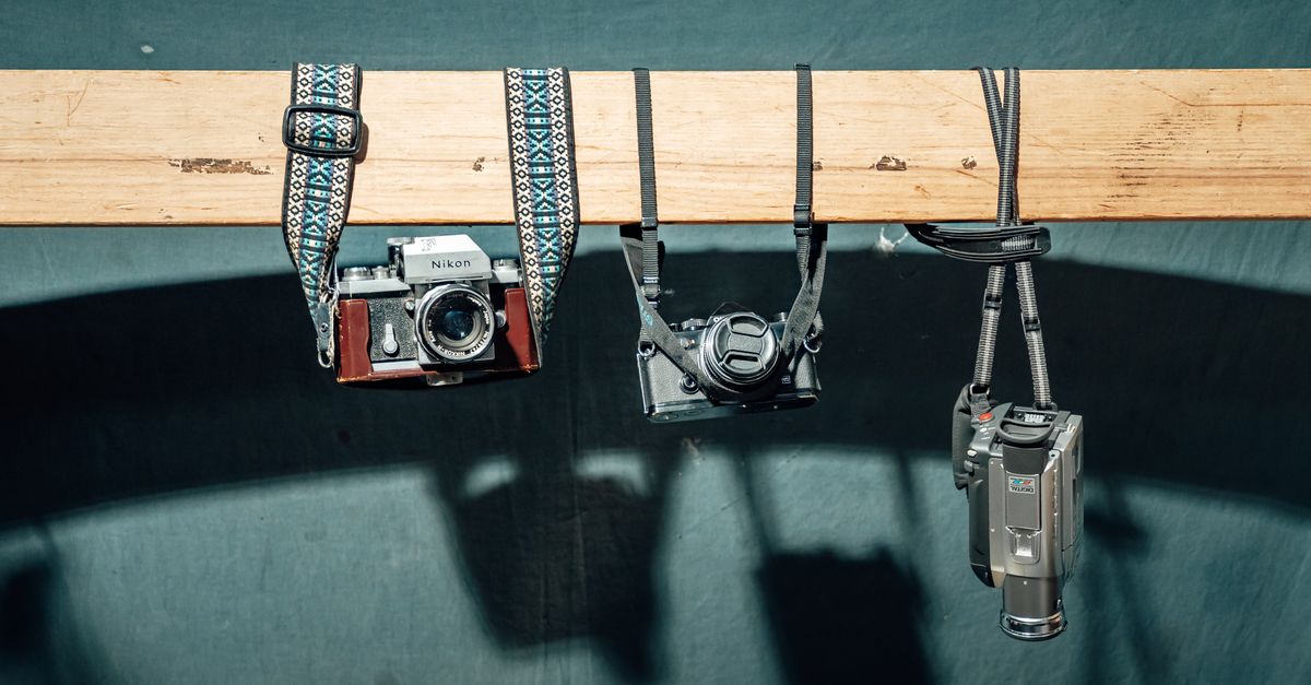 Vintage Cameras Hanging Display in Studio · Free Stock Photo